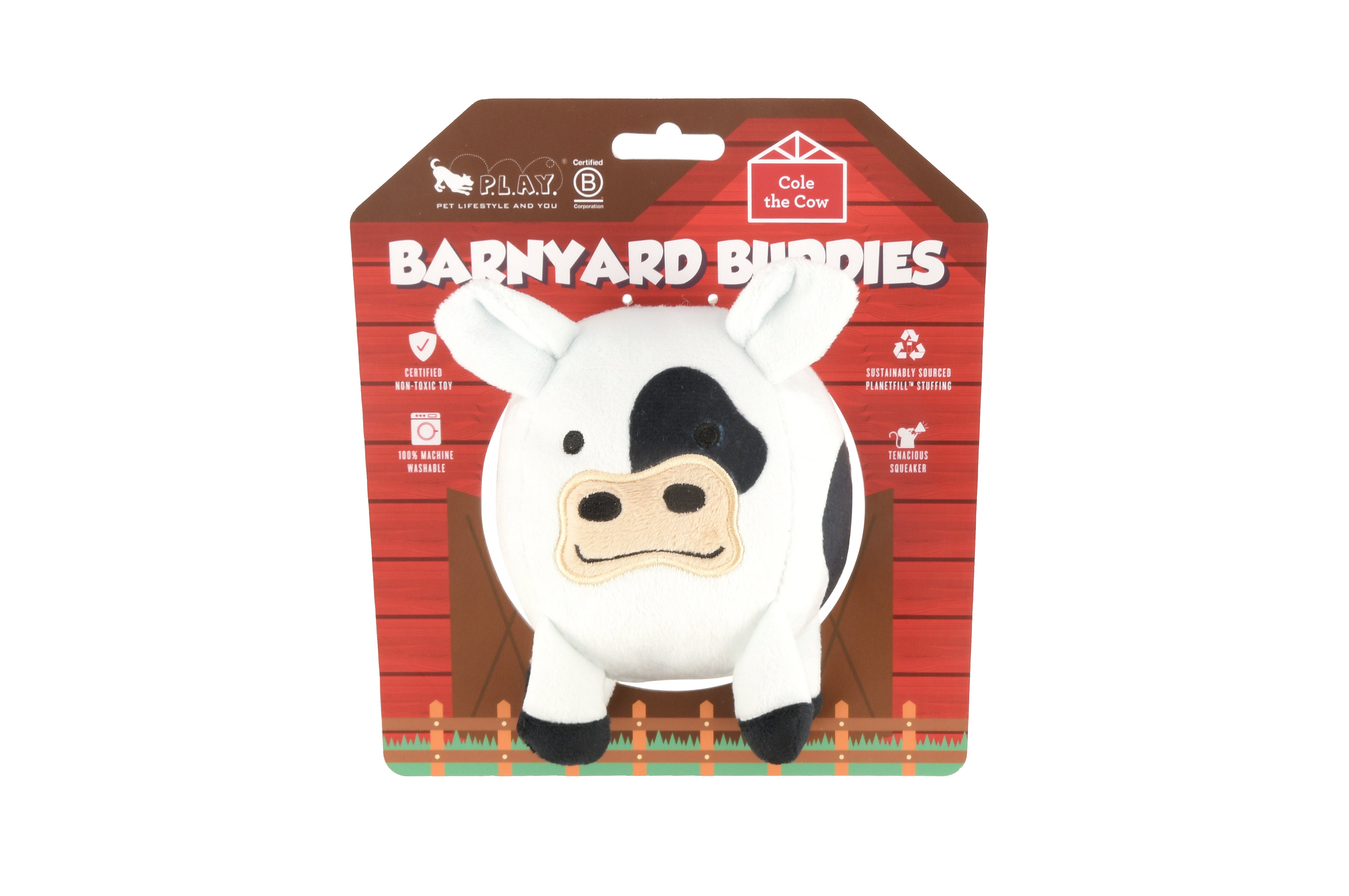 Barnyard Buddies plush cow dog toy in barnyard themed packaging.