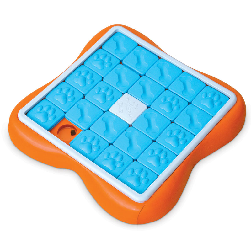 The Challenge Slider dog puzzle helps reduce destructive behavior and fights boredom by keeping your dog busy exercising their mind. Ideal for dogs who have mastered levels 1-2 of the Nina Ottosson puzzle line. Puzzle features a sliding tray with 24-compartments that pulls out from underneath and holds 1 cup of dry food.