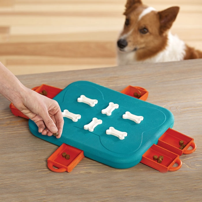 The Dog Casino puzzle helps reduce destructive behavior and fights boredom by keeping your dog busy exercising their mind. Puzzle has 6 treat drawers that encourage your dog to paw, nose, and nudge to access the treats. Lock the bones on the top of the puzzle to increase the difficulty level.