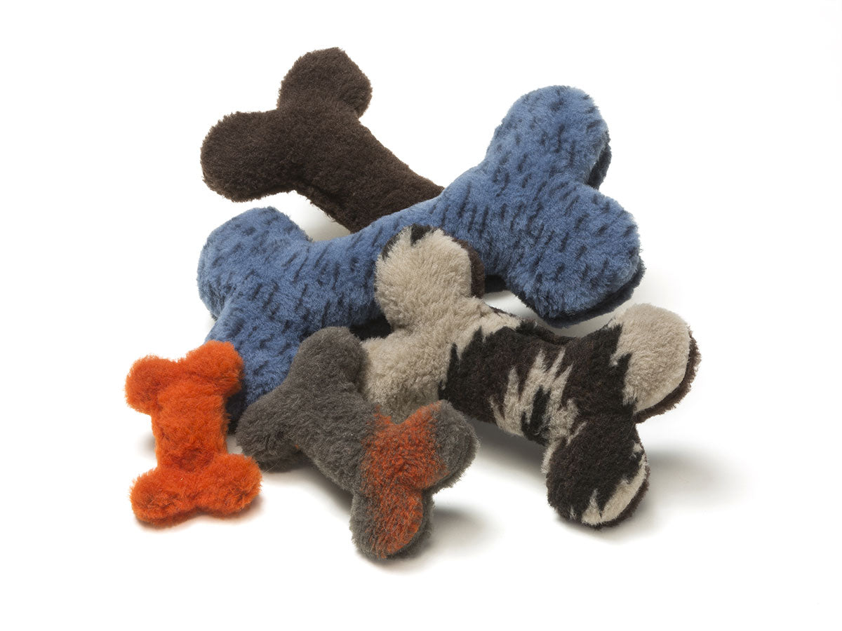 Throw the dog a bone already! The Montana Bones are sure to delight any dog with its attention-grabbing squeaker and eye-catching colors.   Made of 100% eco-friendly IntelliLoft fabric and fill.