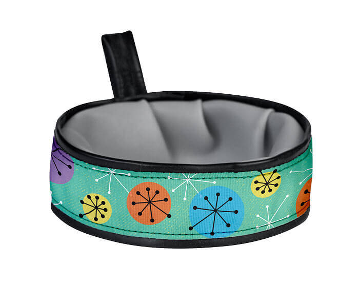 Trail Buddy Collapsible Travel Bowl is waterproof, stylish, functional, durable, and handmade in the USA with recyclable material. The wide and sturdy construction prevents spills, while the compact collapsible design easily stows away when not in use. Includes a carry loop for easy attachment to leashes or bags. Holds 20 ounces of water.