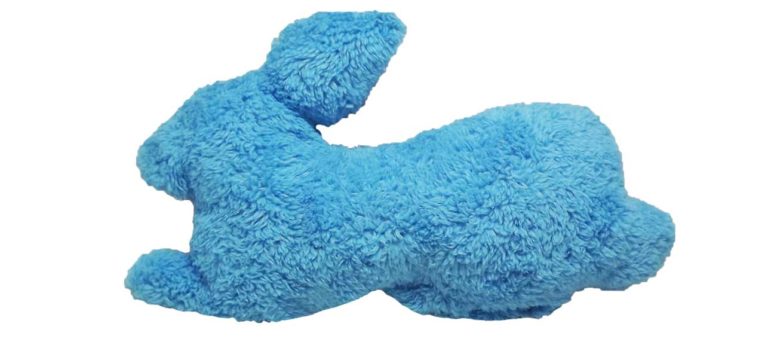 The Fuzzies! Rabbit dog toy is the perfect pillow pal for dogs who love to snuggle with their toys. This durable and soft dog toy is eco-friendly and made in the USA. It features a Duraplush 2-ply bonded outer material, Stitchguard internal seams, and eco-fill recycled filling.