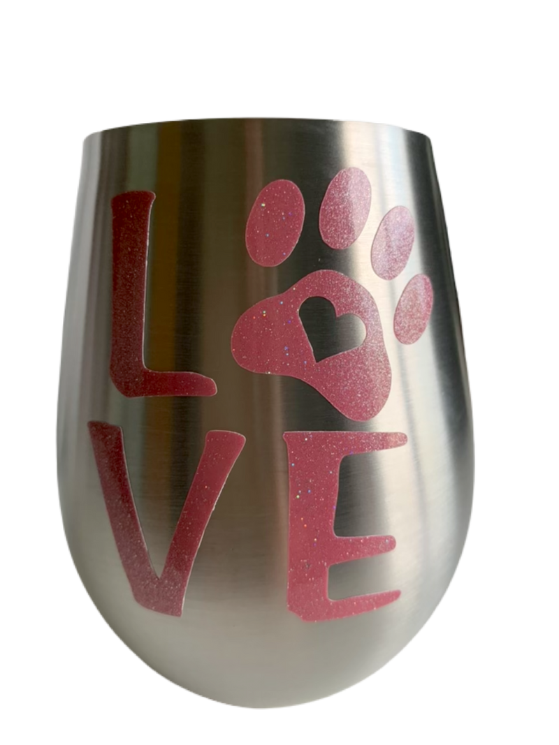 Stemless wine glasses with cute dog designs made with sparkly vinyl. Glasses have a sleek and elegant design, and are made from food-grade stainless steel. These heavy-duty glasses are shatterproof and have a weighted base, making them tip resistant.